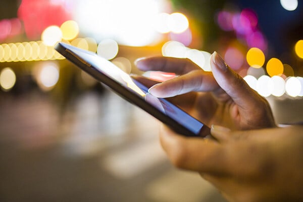 Woman holding mobile phone